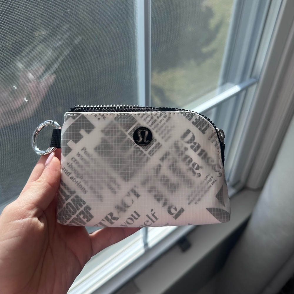 Lululemon “Clippable Card Pouch
Manifesto Print”